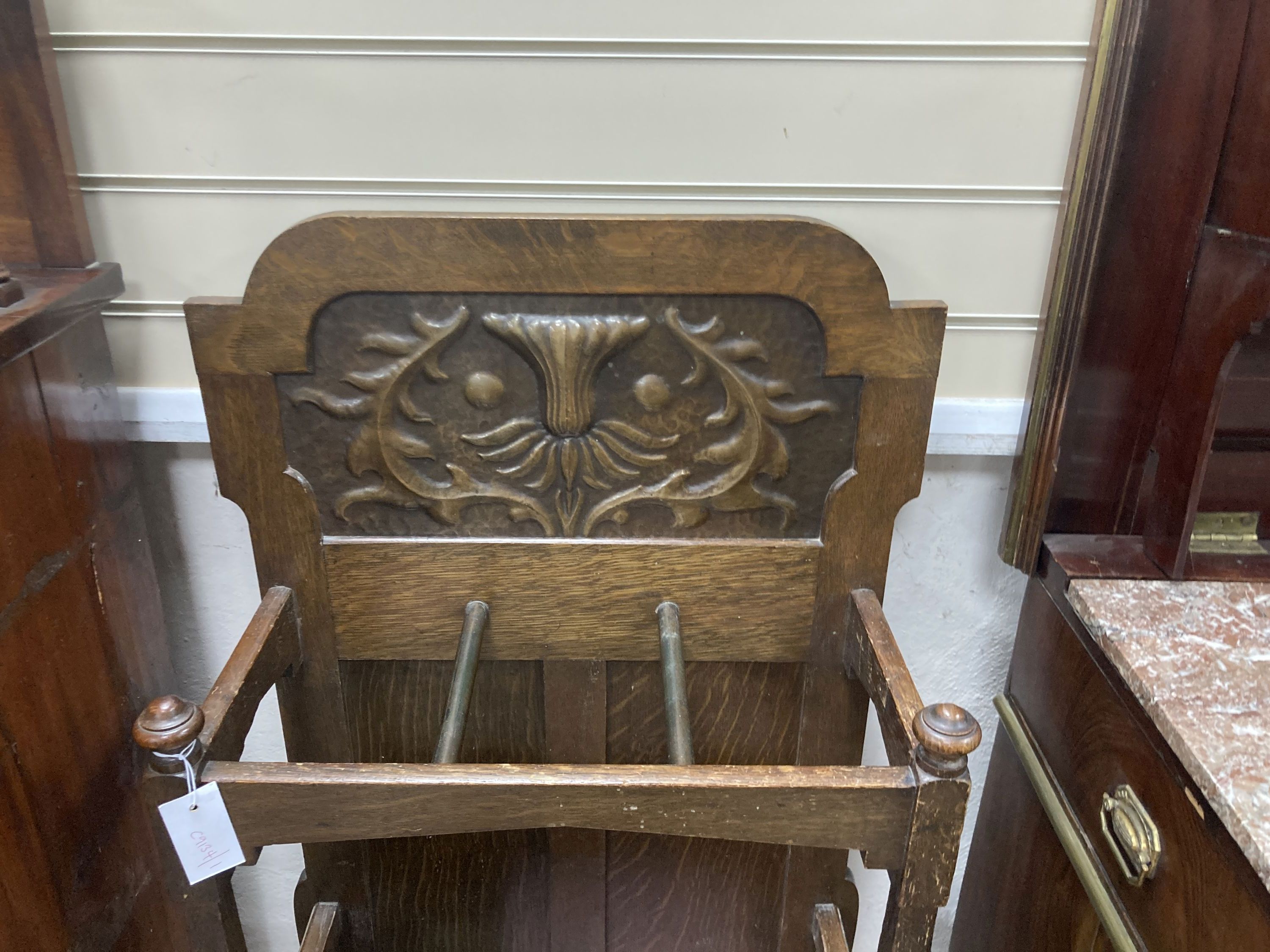 An early 20th century oak umbrella stand in the Arts & Crafts style, attributed to Shapland & Petter, width 52cm, depth 26cm, height 10